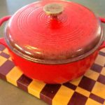 Red Dutch Oven on a butch block