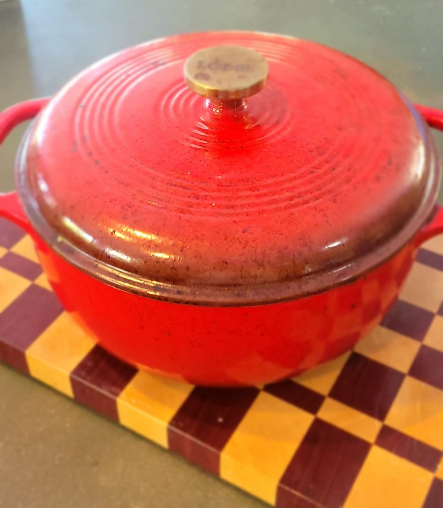 Red Dutch Oven on a butch block